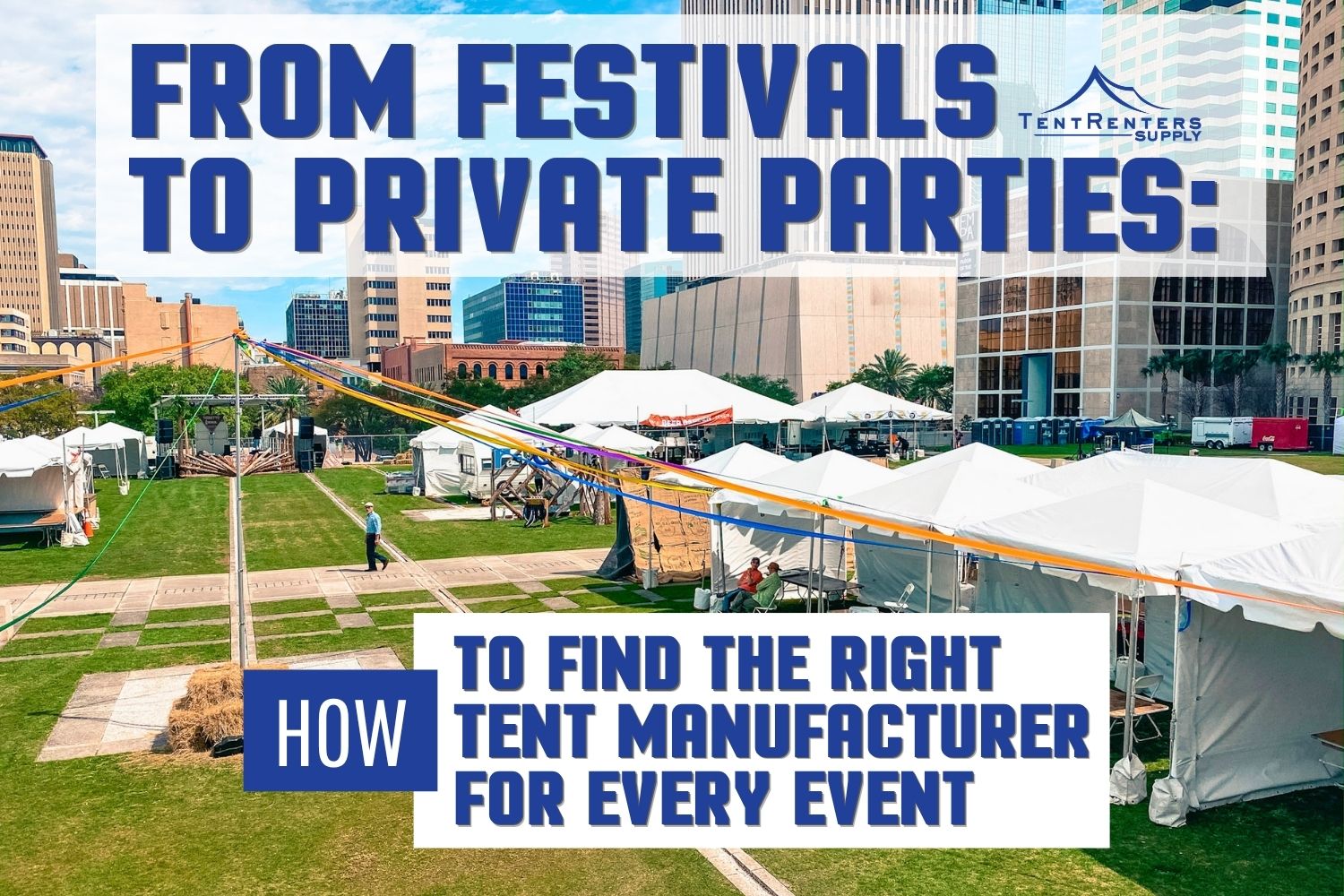 White event tents set up in a grassy city park with a downtown skyline backdrop